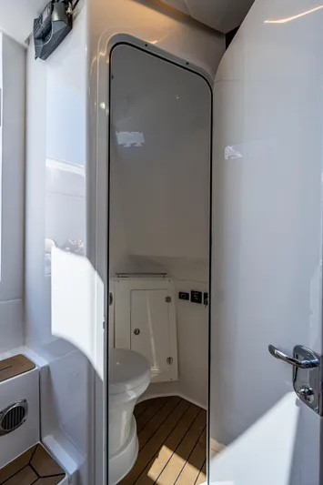Tingum Yacht Photos Pics 2021 HCB 42 Lujo boat bathroom with modern fixtures and wooden flooring.