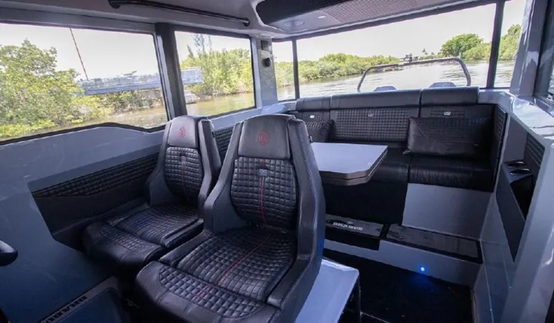  Yacht Photos Pics Interior of 2021 BRABUS Brabus Shadow 900 BO luxury boat with leather seating and table.