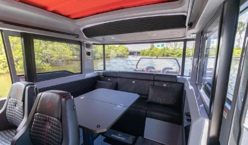  Yacht Photos Pics Interior of 2021 BRABUS Brabus Shadow 900 BO luxury boat with seating and table.