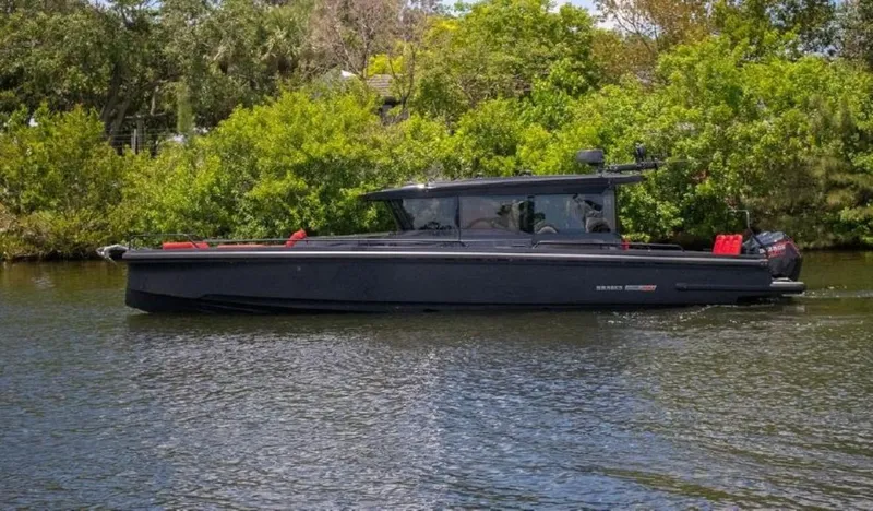  Yacht Photos Pics 2021 BRABUS Shadow 900 BO boat cruising on a calm river.