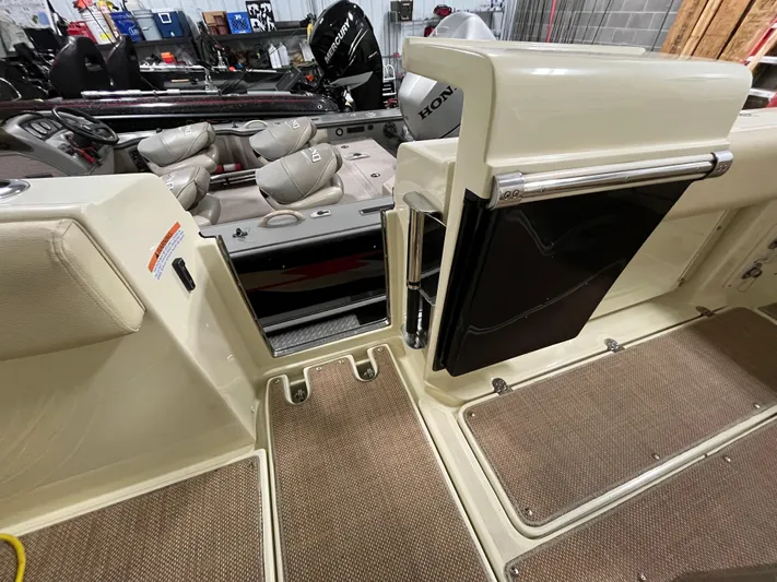  Yacht Photos Pics 2020 Chris-Craft 30 Catalina interior with seating and storage compartments.