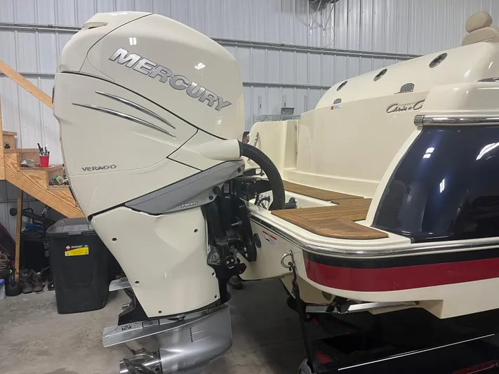  Yacht Photos Pics 2020 Chris-Craft 30 Catalina with Mercury Verado outboard engine in a garage setting.