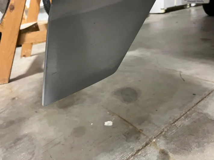  Yacht Photos Pics Close-up of a 2020 Chris-Craft 30 Catalina boat's hull detail in a garage.