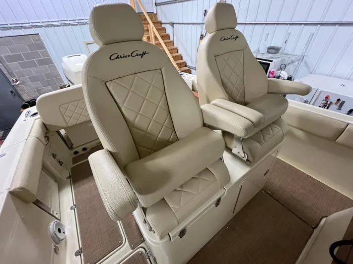  Yacht Photos Pics Luxurious seating on 2020 Chris-Craft 30 Catalina boat, featuring beige leather upholstery.