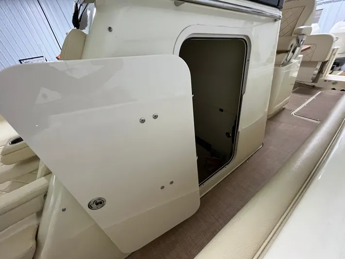  Yacht Photos Pics 2020 Chris-Craft 30 Catalina interior storage compartment with open door.