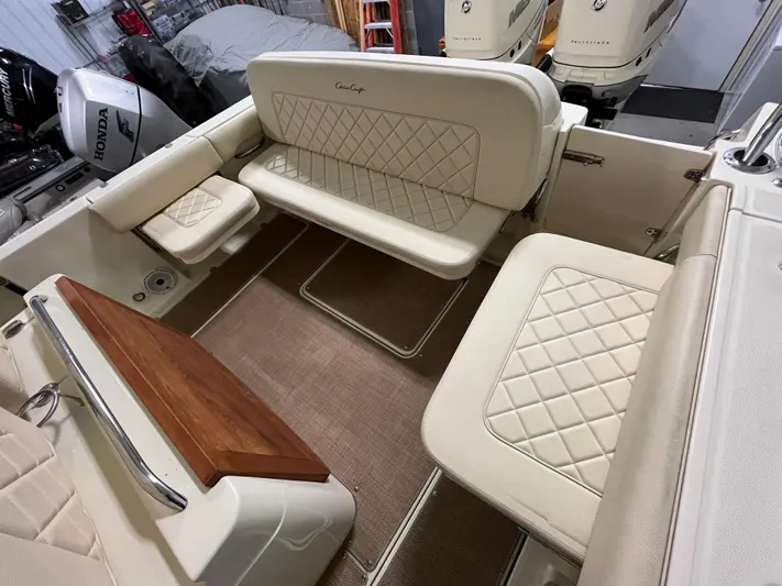  Yacht Photos Pics 2020 Chris-Craft 30 Catalina interior with beige quilted seating and dual outboard motors.