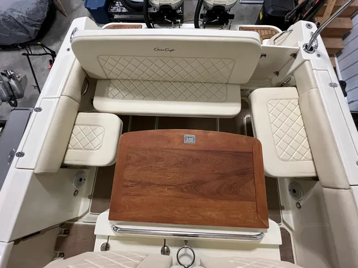  Yacht Photos Pics 2020 Chris-Craft 30 Catalina interior with elegant seating and wooden table.