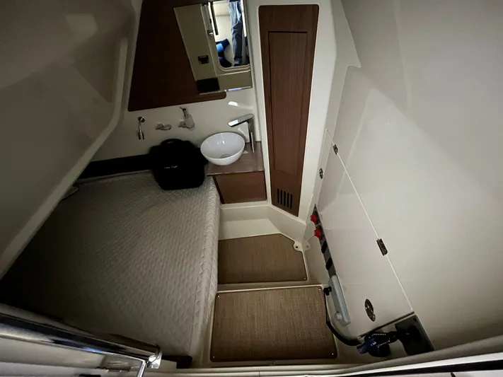  Yacht Photos Pics 2020 Chris-Craft 30 Catalina cabin interior with bed, sink, and storage.