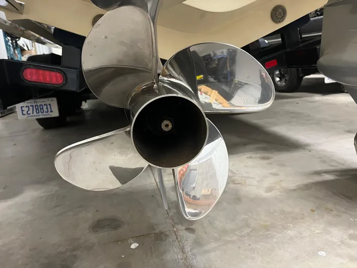  Yacht Photos Pics Propeller of a 2020 Chris-Craft 30 Catalina boat in a garage setting.