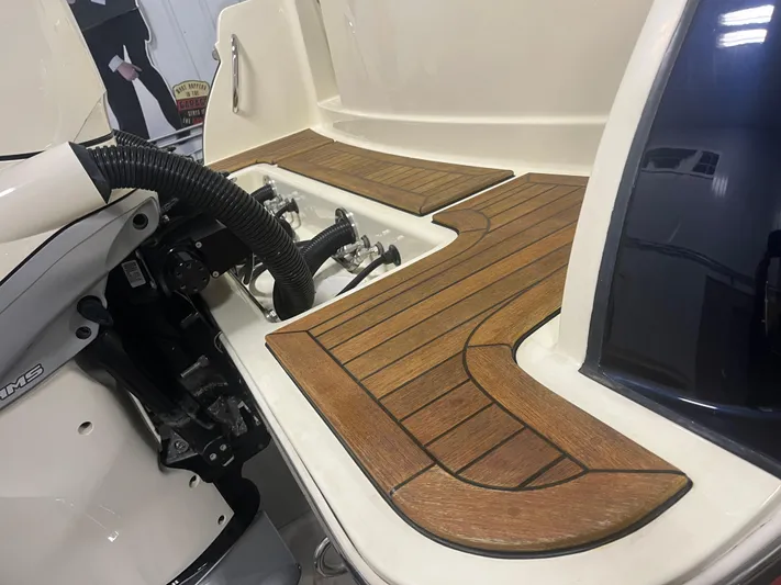  Yacht Photos Pics 2020 Chris-Craft 30 Catalina boat deck with wood finish and engine components.