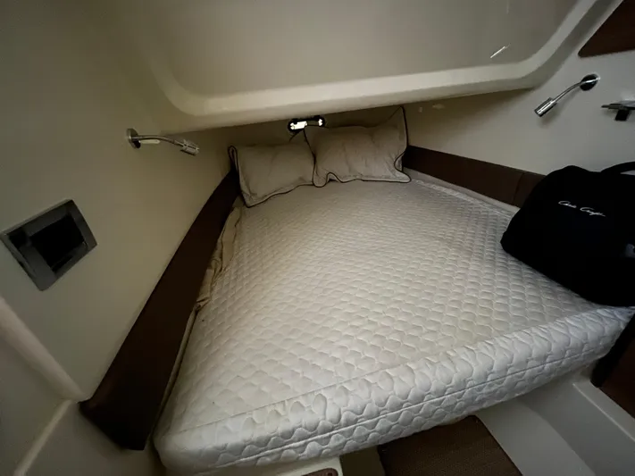  Yacht Photos Pics 2020 Chris-Craft 30 Catalina cabin interior with bed and pillows.