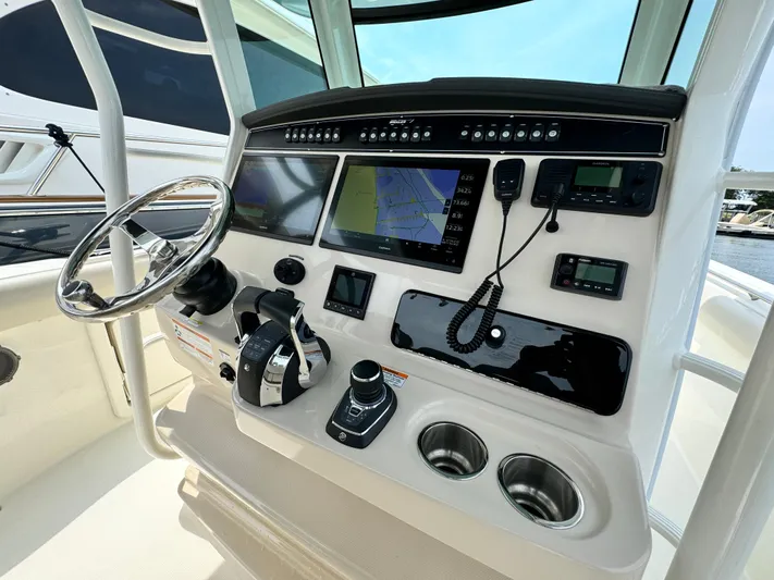 Just Wednesdays Yacht Photos Pics 2022 Boston Whaler 330 Outrage helm with advanced navigation and control systems.