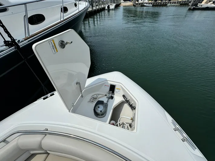 Just Wednesdays Yacht Photos Pics 2022 Boston Whaler 330 Outrage bow with open anchor locker at marina.