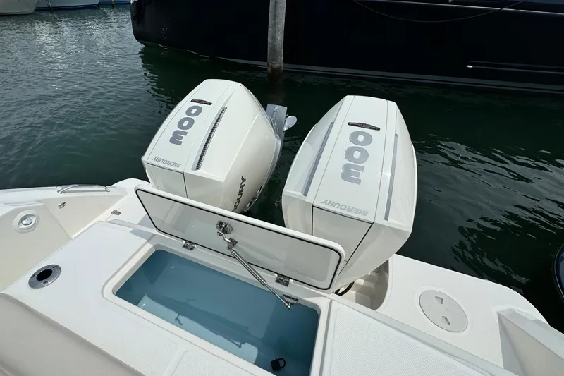 Just Wednesdays Yacht Photos Pics 2022 Boston Whaler 330 Outrage with twin Mercury outboard engines on water.