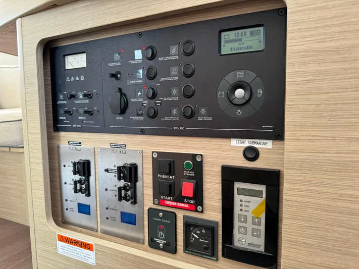  Yacht Photos Pics Control panel of a 2023 Lagoon 42 yacht, featuring various switches and displays.