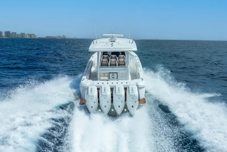  Yacht Photos Pics 2024 Intrepid 427 Nomad SE cruising on open ocean, showcasing powerful engines and sleek design.