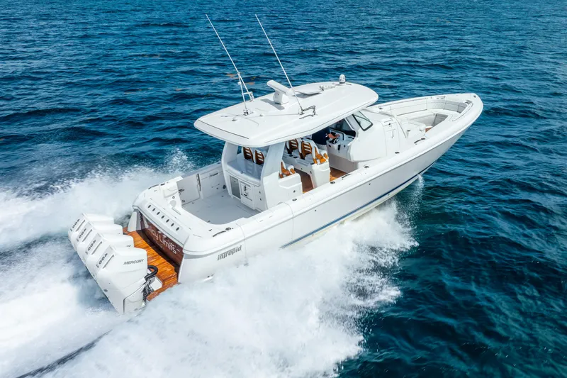  Yacht Photos Pics 2024 Intrepid 427 Nomad SE cruising on open ocean waters.