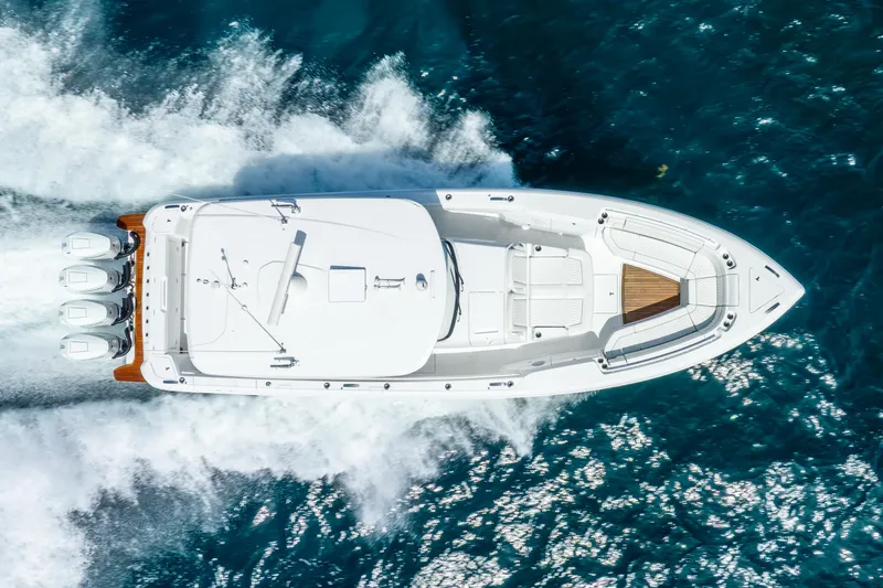  Yacht Photos Pics 2024 Intrepid 427 Nomad SE cruising on open water, aerial view.