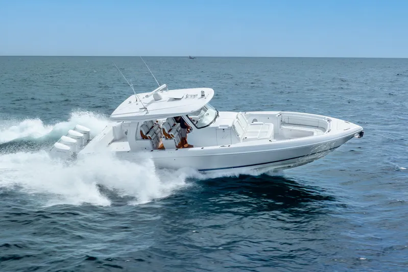  Yacht Photos Pics 2024 Intrepid 427 Nomad SE cruising on open water, showcasing sleek design and powerful performance.