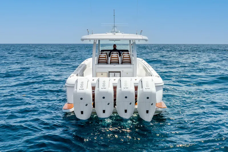  Yacht Photos Pics 2024 Intrepid 427 Nomad SE boat with four engines cruising on open sea.