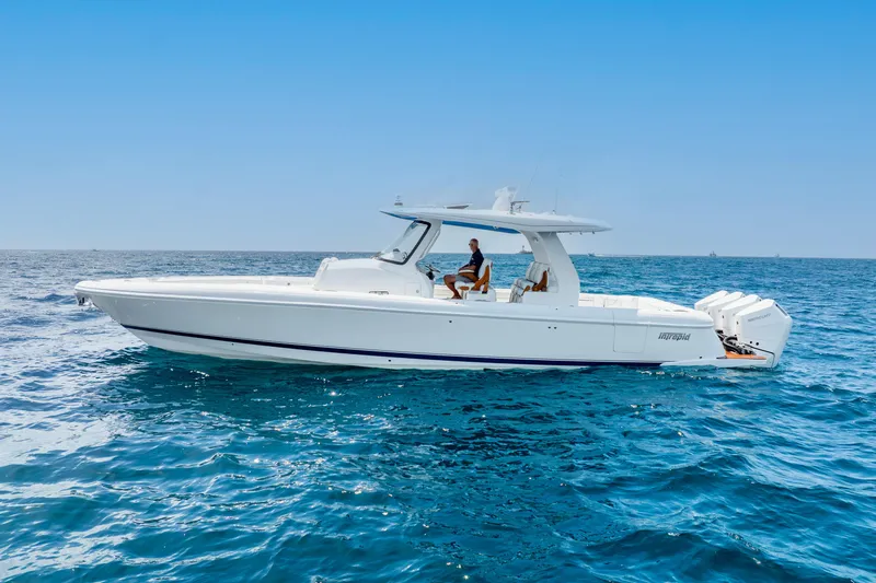  Yacht Photos Pics 2024 Intrepid 427 Nomad SE boat cruising on open blue sea.