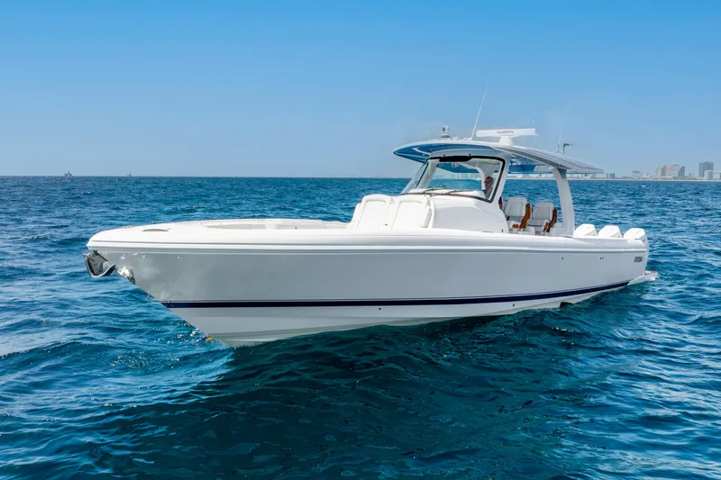  Yacht Photos Pics 2024 Intrepid 427 Nomad SE boat cruising on open blue ocean.