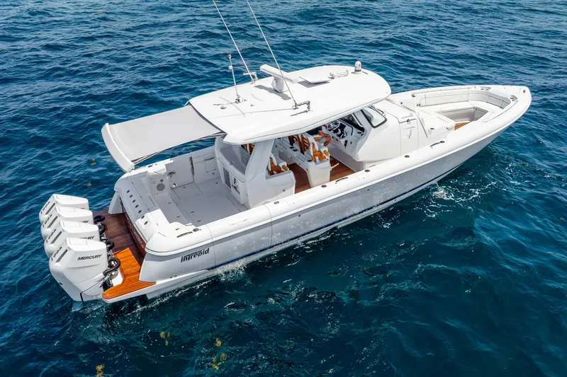  Yacht Photos Pics 2024 Intrepid 427 Nomad SE boat cruising on open blue water.