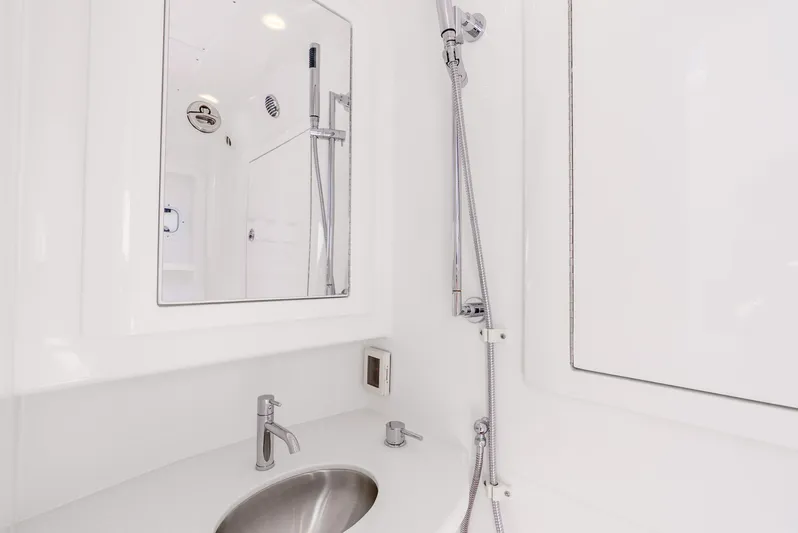 Yacht Photos Pics 2024 Intrepid 427 Nomad SE bathroom with modern sink and shower fixtures.