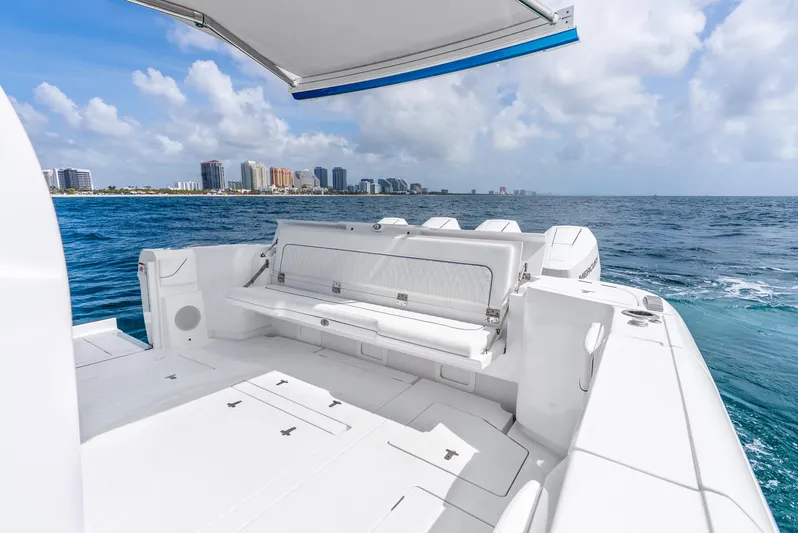  Yacht Photos Pics 2024 Intrepid 427 Nomad SE boat with city skyline and ocean view.