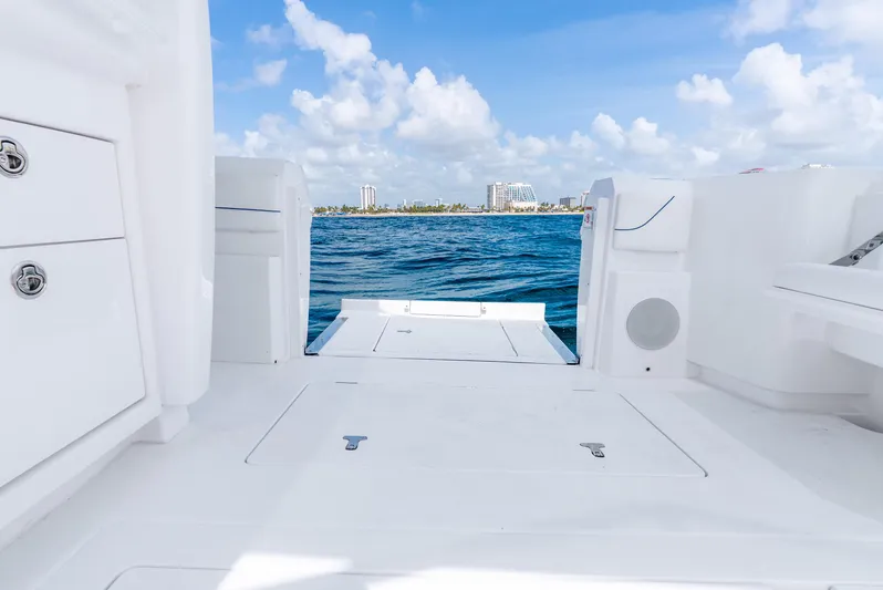  Yacht Photos Pics 2024 Intrepid 427 Nomad SE boat deck with ocean view and clear blue sky.