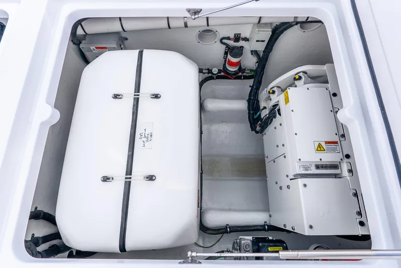  Yacht Photos Pics Engine compartment of 2024 Intrepid 427 Nomad SE boat, showcasing equipment and wiring.