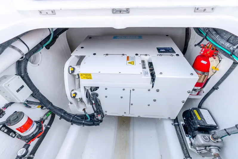  Yacht Photos Pics 2024 Intrepid 427 Nomad SE engine compartment with wiring and fire extinguisher.