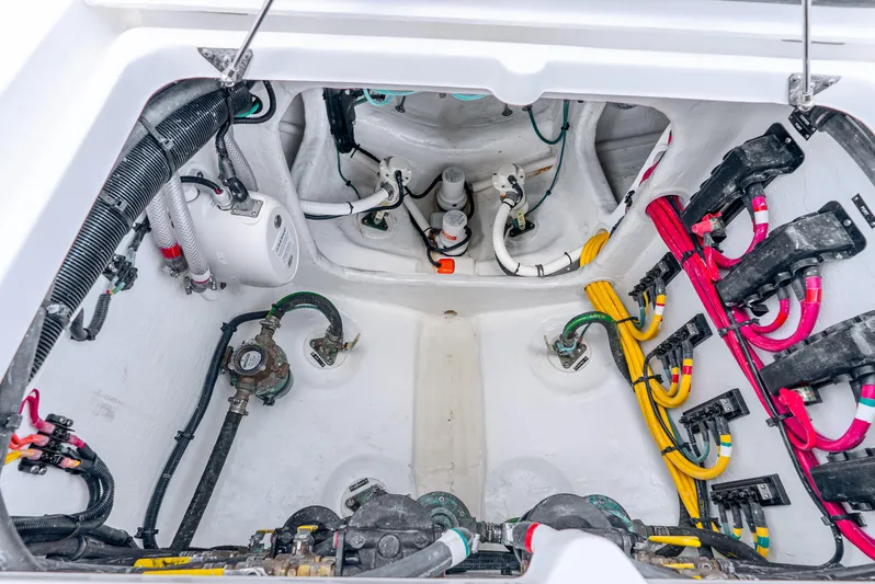  Yacht Photos Pics Engine compartment of 2024 Intrepid 427 Nomad SE, showcasing wiring and mechanical components.