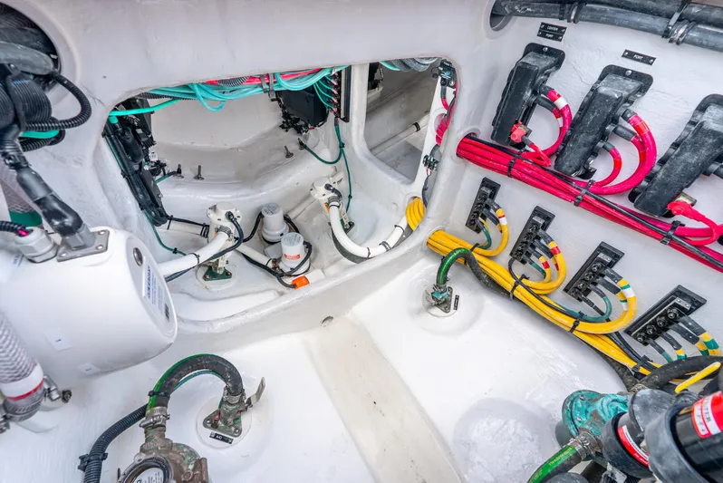  Yacht Photos Pics Engine room of 2024 Intrepid 427 Nomad SE with colorful wiring and components.