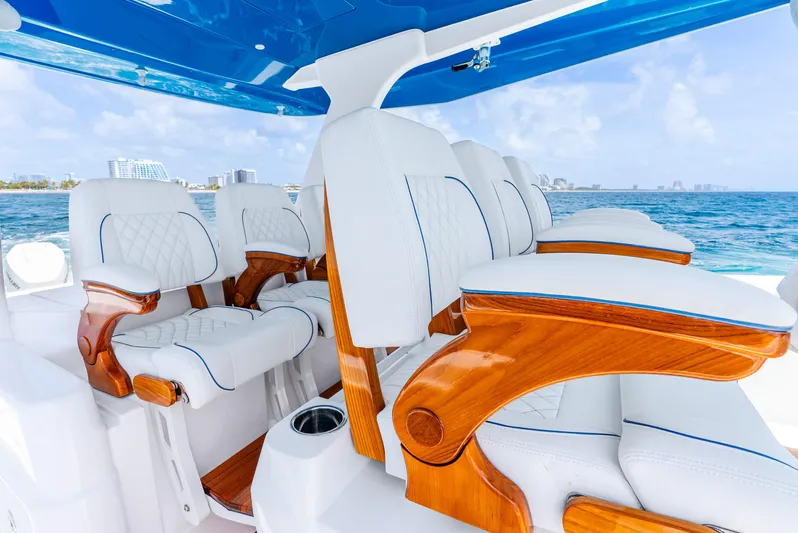  Yacht Photos Pics Luxurious seating on 2024 Intrepid 427 Nomad SE boat, featuring white leather and wooden accents.