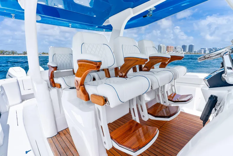  Yacht Photos Pics 2024 Intrepid 427 Nomad SE boat interior with luxurious seating and ocean view.