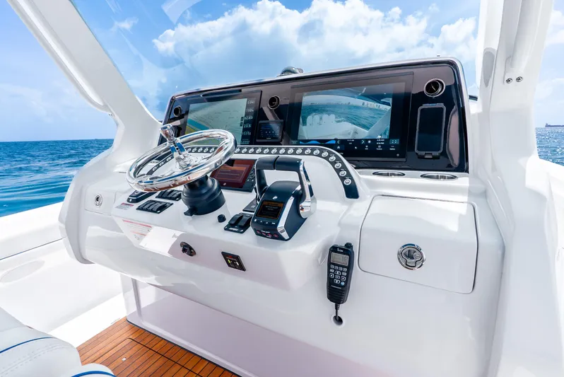  Yacht Photos Pics 2024 Intrepid 427 Nomad SE helm with advanced navigation systems and ocean view.