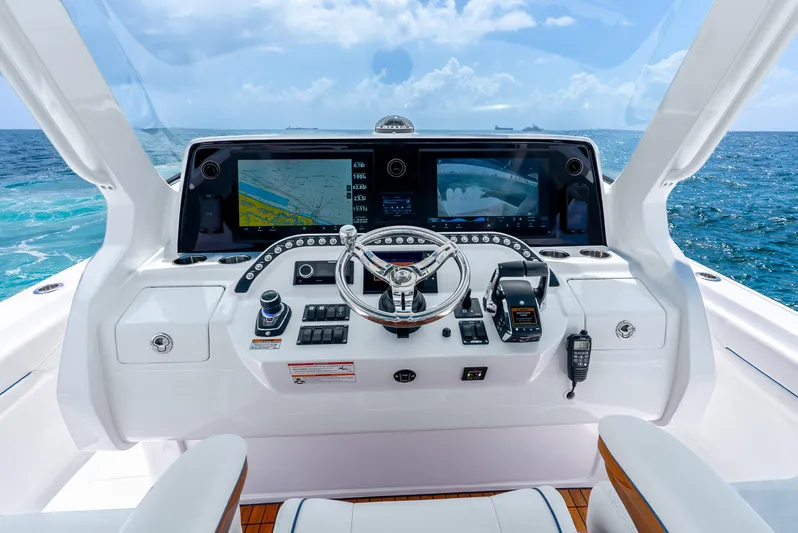  Yacht Photos Pics Cockpit of 2024 Intrepid 427 Nomad SE with advanced navigation systems and ocean view.