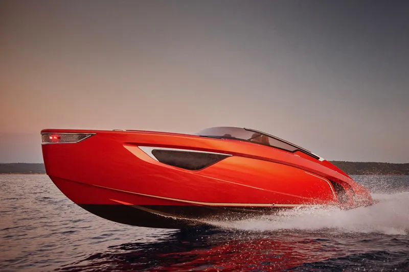  Yacht Photos Pics 2026 Flynt Yachts Centura 32, sleek red design, cruising on open water at sunset.