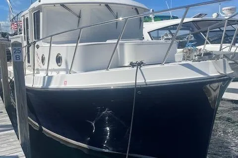  Yacht Photos Pics 2018 American Tug 365 docked, showcasing sleek design and sturdy build.