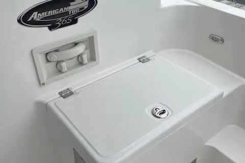  Yacht Photos Pics 2018 American Tug 365 boat detail with storage compartment and logo.