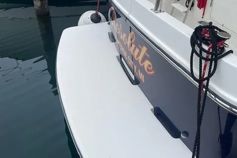  Yacht Photos Pics 2018 American Tug 365 docked, showing stern with ropes and fender.