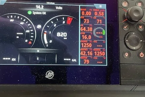  Yacht Photos Pics Dashboard of a 2018 American Tug 365 displaying engine metrics and system status.