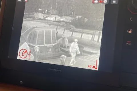  Yacht Photos Pics Thermal camera view on American Tug 365, 2018 model, showing people on a dock.