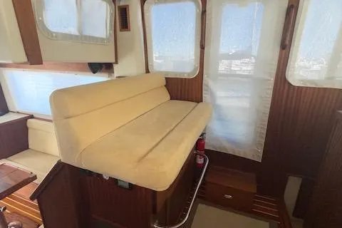  Yacht Photos Pics Interior of 2018 American Tug 365 with beige seating and wooden accents.