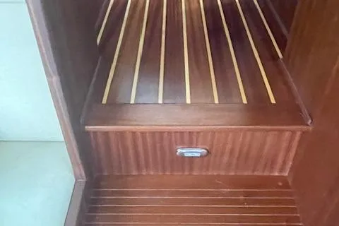  Yacht Photos Pics Wooden interior stairs of a 2018 American Tug 365 boat.