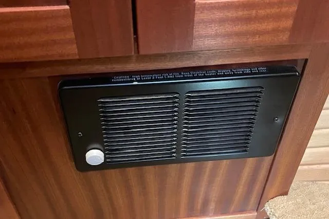  Yacht Photos Pics Ventilation panel on 2018 American Tug 365 boat, featuring wooden cabinetry.