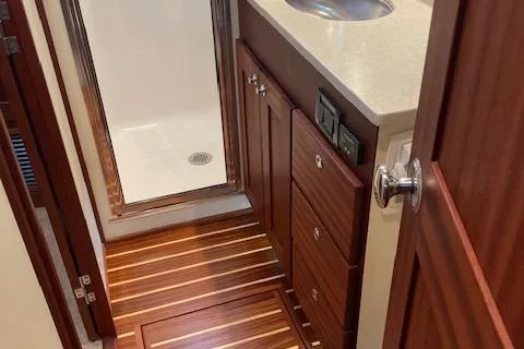  Yacht Photos Pics 2018 American Tug 365 bathroom with wood flooring and modern fixtures.