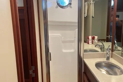  Yacht Photos Pics Bathroom interior of 2018 American Tug 365 with shower and sink.
