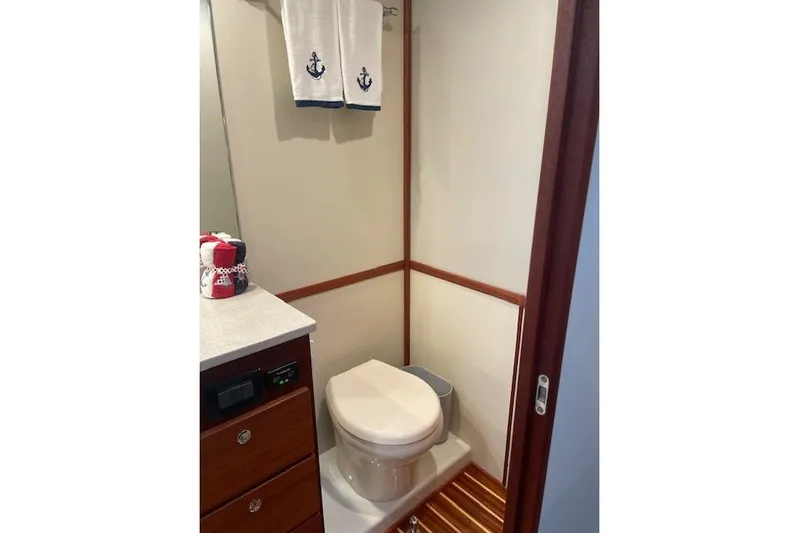  Yacht Photos Pics Bathroom interior of 2018 American Tug 365 with nautical-themed decor.